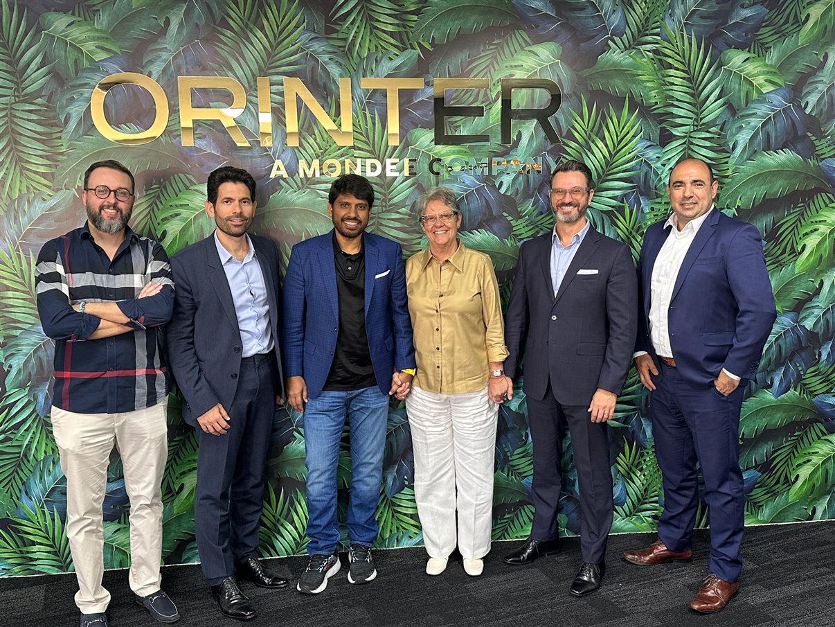 Roberto Sanches, diretor da Orinter, Orestes Fintiklis, chairman da Mondee, Prasad Gundumogula, CEO da Mondee, Ana Maria Berto, CEO da Orinter, Jesus Portillo, CFO da Mondee, e Carlos Bueno, CFO da Orinter